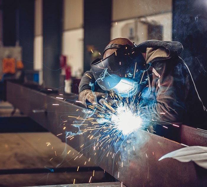 Welder welding after using Genius Shop Floor Software