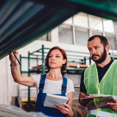 2 workers doing inventory on shop floor