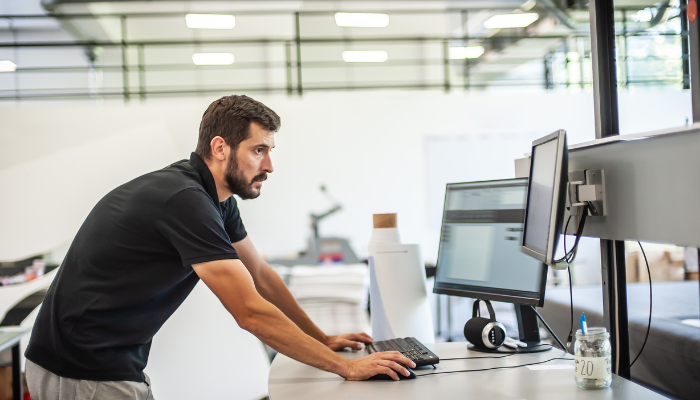 Man working and looking intently at a computer