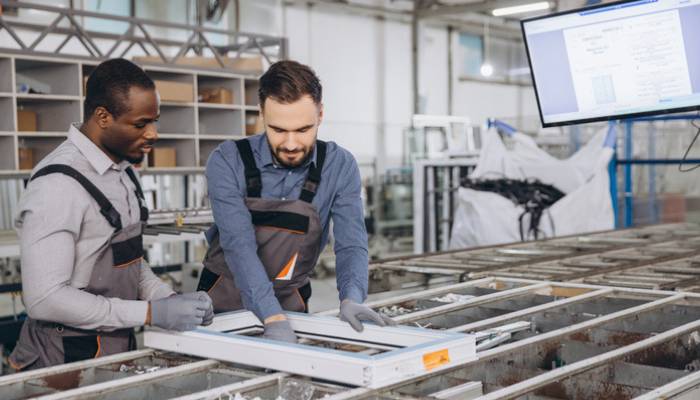 Shop floor employees working with ERP