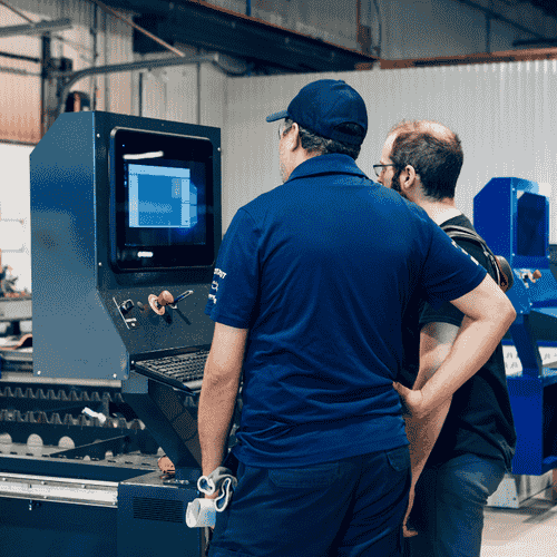 two manufacturers looking at machine screen